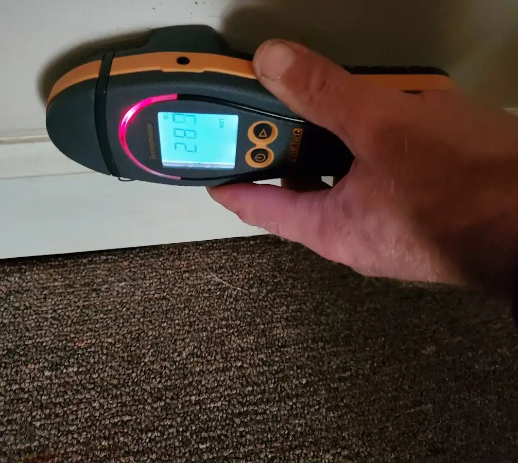 Moisture detection at baseboard during Storm Damage Restoration in Ville Platte